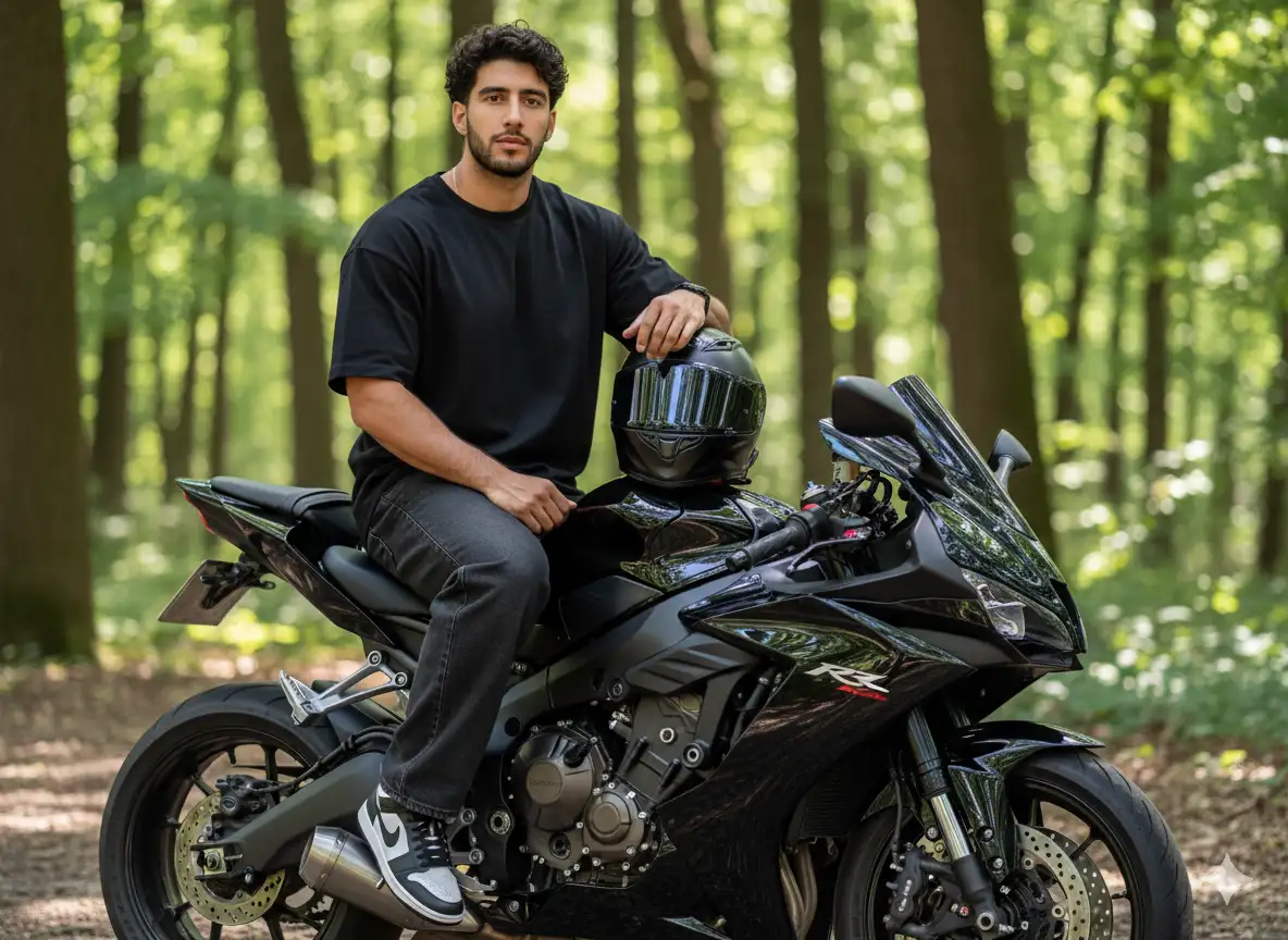 Create an image of me [photo attached] as an ultra-realistic portrait. I'm sitting on a shiny black sports bike outdoors against a backdrop of green trees. I'm wearing a loose black t-shirt, loose dark jeans with cuffs at the bottom, and black and white Nike sneakers. Accessories include a black watch. My left hand rests casually on my thigh, while my right hand rests on the bike, holding a shiny black helmet with a clear visor.
The bike looks detailed with a large engine, a strong frame, and shiny chrome details, accentuating the modern and powerful impression. The background features tall trees with soft natural light, creating a balanced blend of shadow and light. The expression is calm and confident, looking directly at the camera.
The overall style is cinematic and modern, combining the feel of youthful streetwear with the presence of a bold motorcycle. High-resolution, photorealistic editorial style.